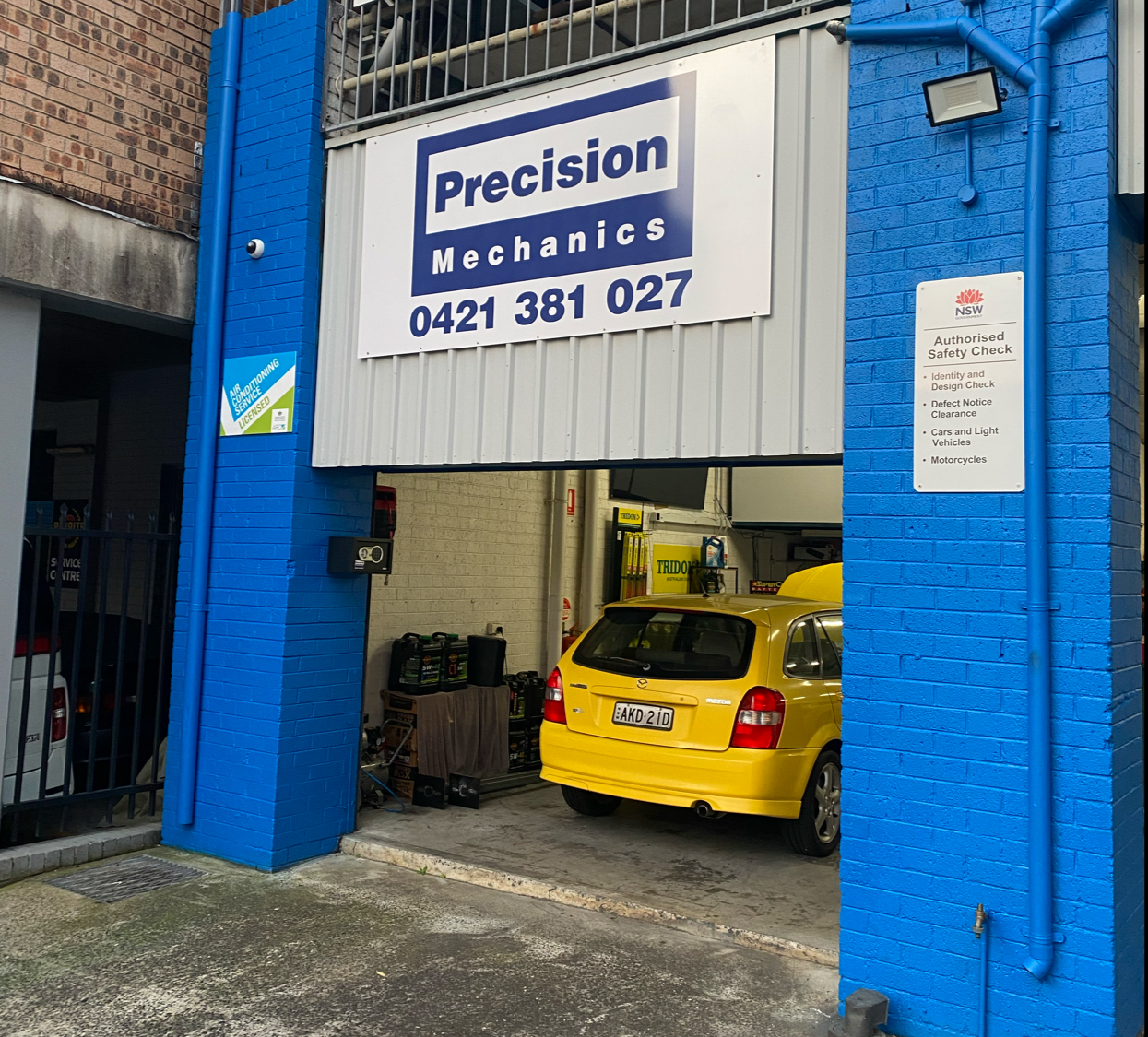 The Precision Mechanics workshop bay on Hunter Lane, Hornsby, with a car in for work